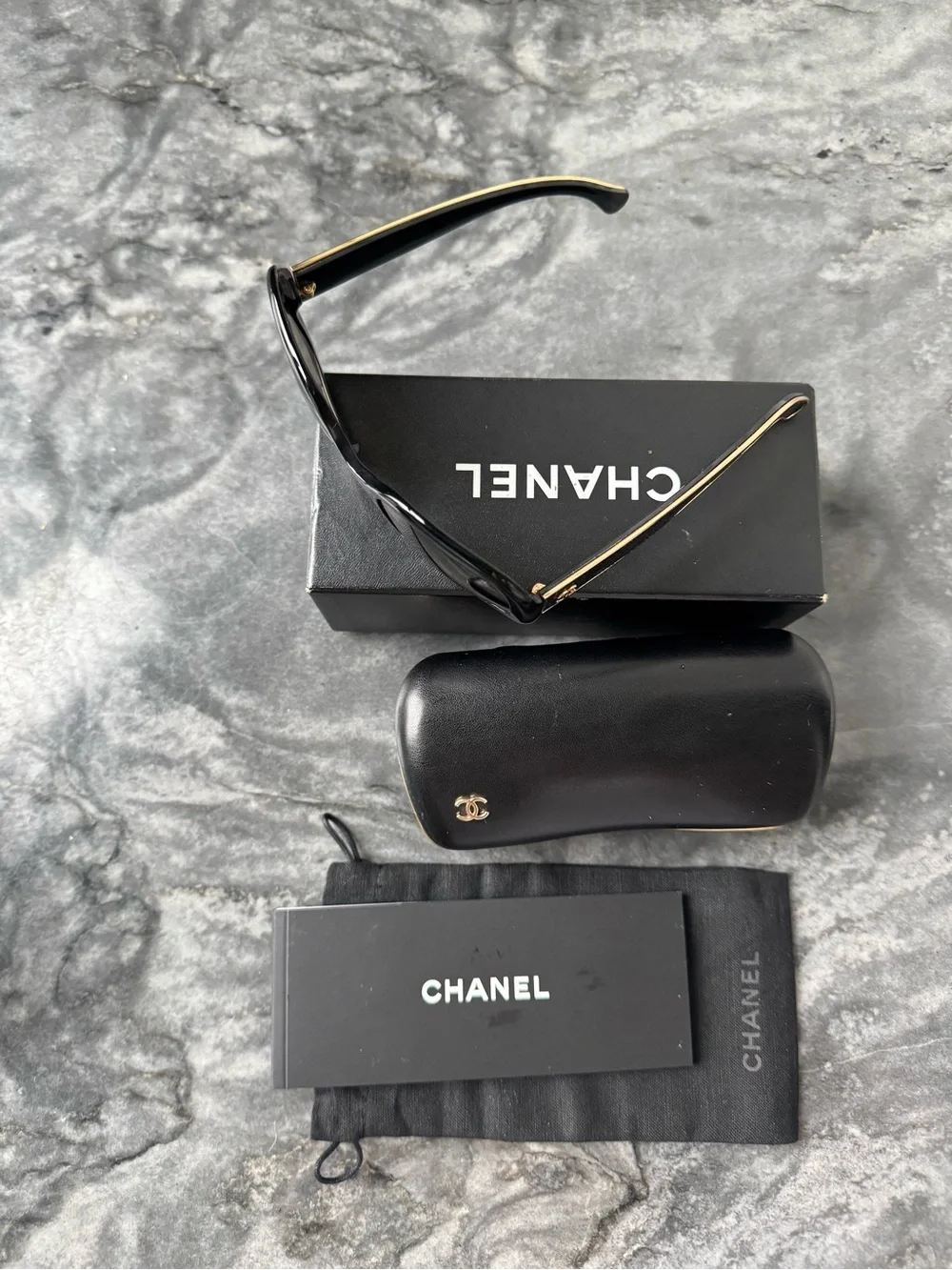 CHANEL Black Sunglasses with Gold Logo Accent